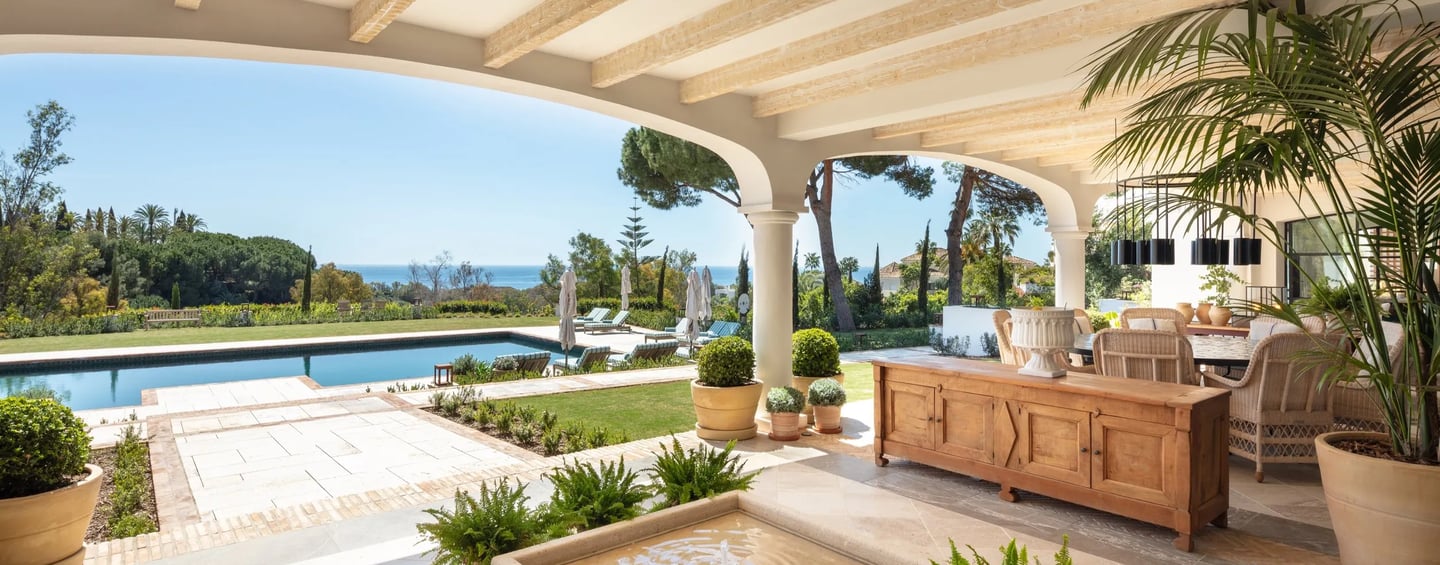 Terrace lounge at Villa La Gratitud with sea views and shaded pergola