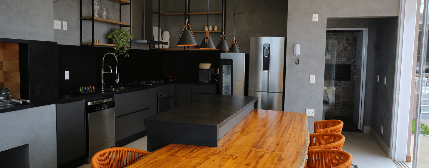 a kitchen with a wooden table and chairs