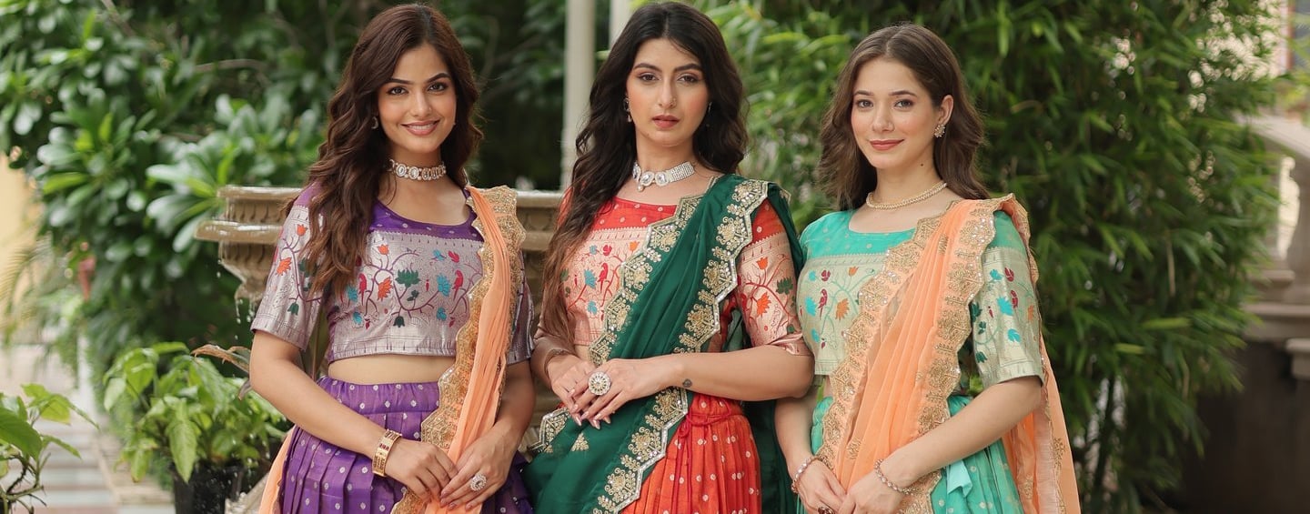 Three women in colorful Bridesmaid Lehenga