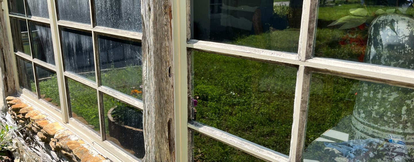 Professional window cleaning service in action, leaving windows spotless and streak-free