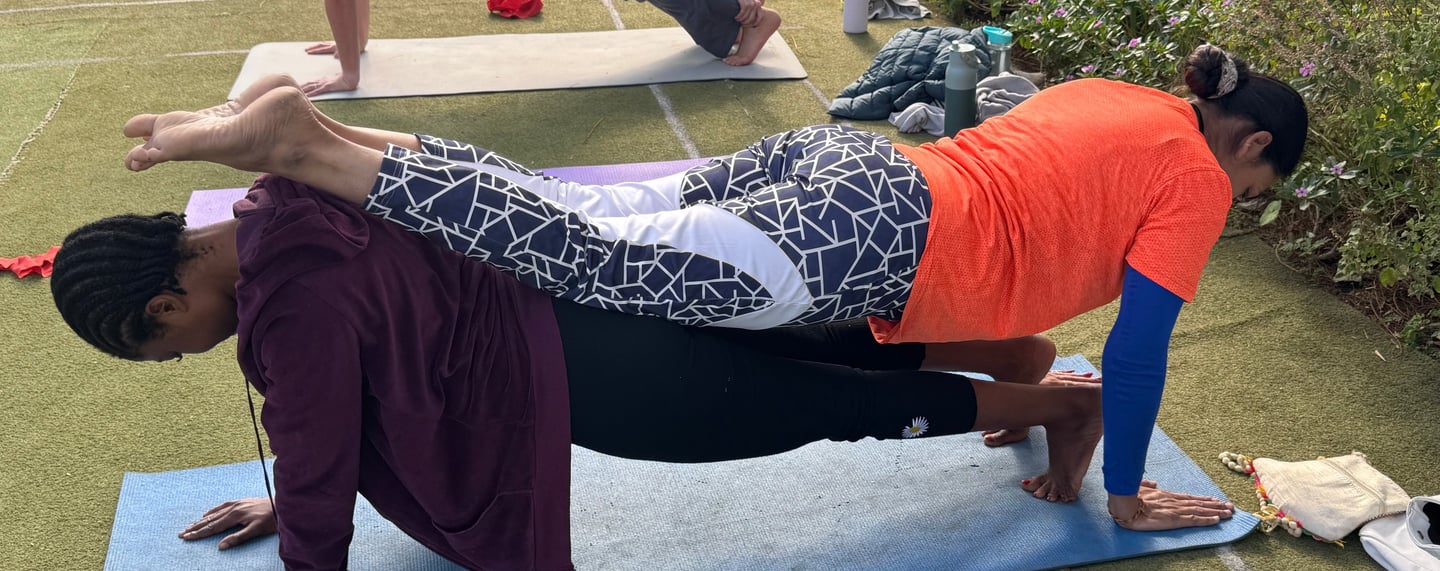 Partner yoga posture where two members are involved in supporting each other in better posture