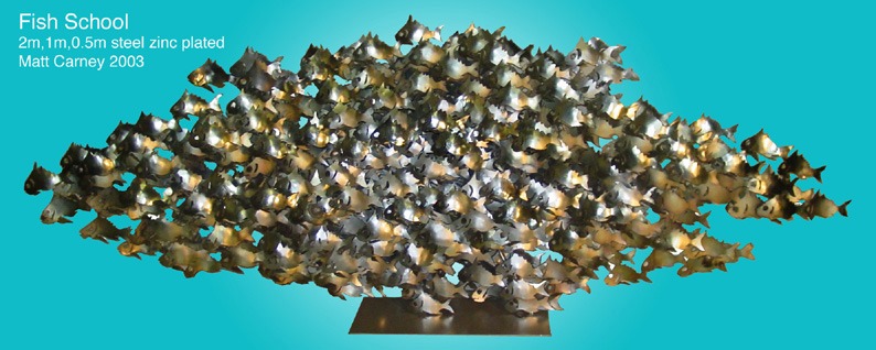 a zinc plated steel sculpture of a school of fish 