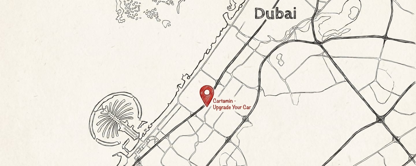 A minimalist street map of Dubai featuring a red location pin for Cartamin - Upgrade Your Car near Palm Jumeirah.