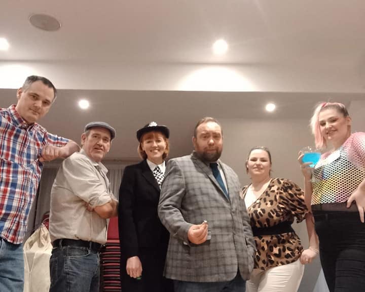 a group of people standing in a room