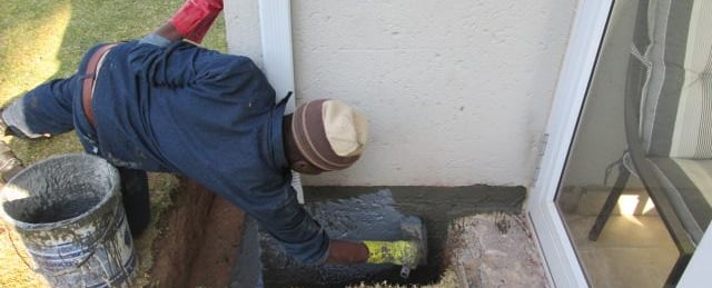 Specialized sealer coat application for foundation layer bricks below ground level to prevent ingress, Randburg