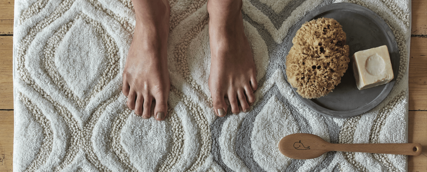 Export-quality bath mats with towels and decor