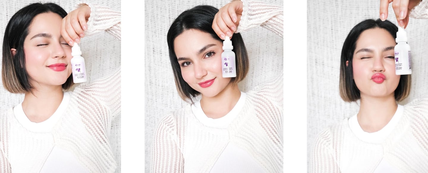 Middle Eastern young woman holding Aster Saffron Face Serum