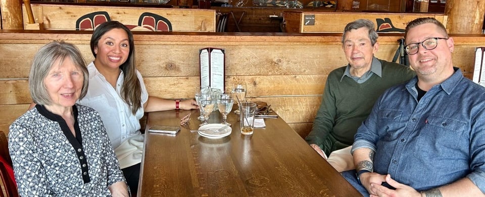 a group of people sitting at a table