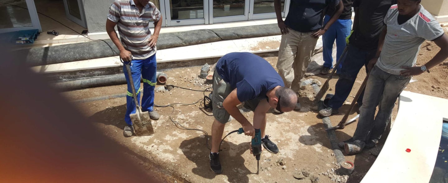 Slowly drilling of the slab to release trapped water for advanced waterproofing project, Sandton, Fredman Drive