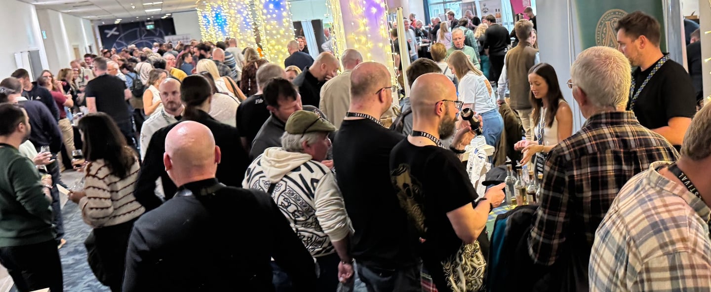 group shot of people at The Edinburgh Whisky Whisky Festival in Edinburgh, Scotland.