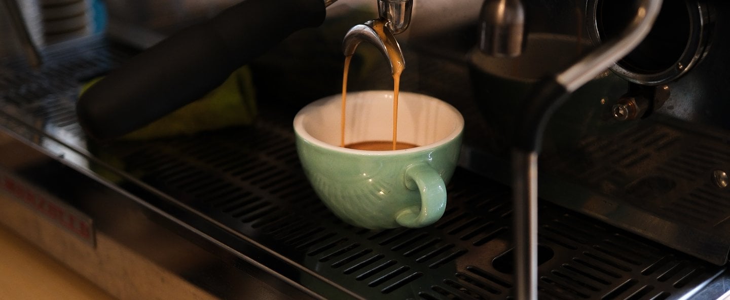 La Marzocco coffee machine is being used to make a cup of coffee