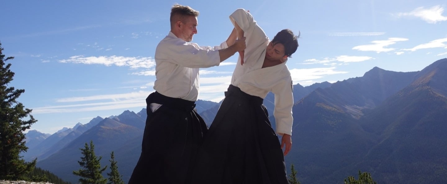 Aikidō students practicing ikkyo wrist control technique during class at Calgary Rakushinkan dojo.
