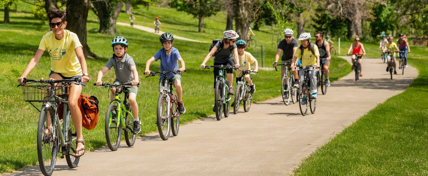 Woman leading group of people on bikes