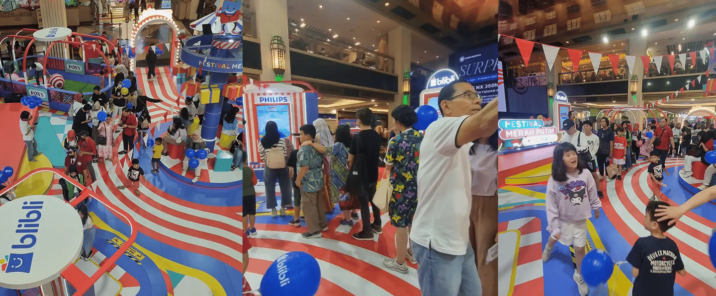 Crowd of mall visitors watching interactive Independence Day games at Blibli booth
