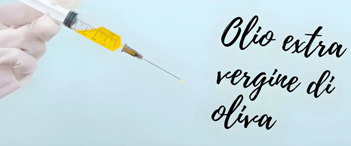 Spritze mit Olivenöl zur Darstellung von gepanschtem Olivenöl