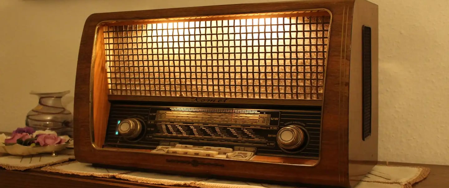 brown and black radio on brown wooden table