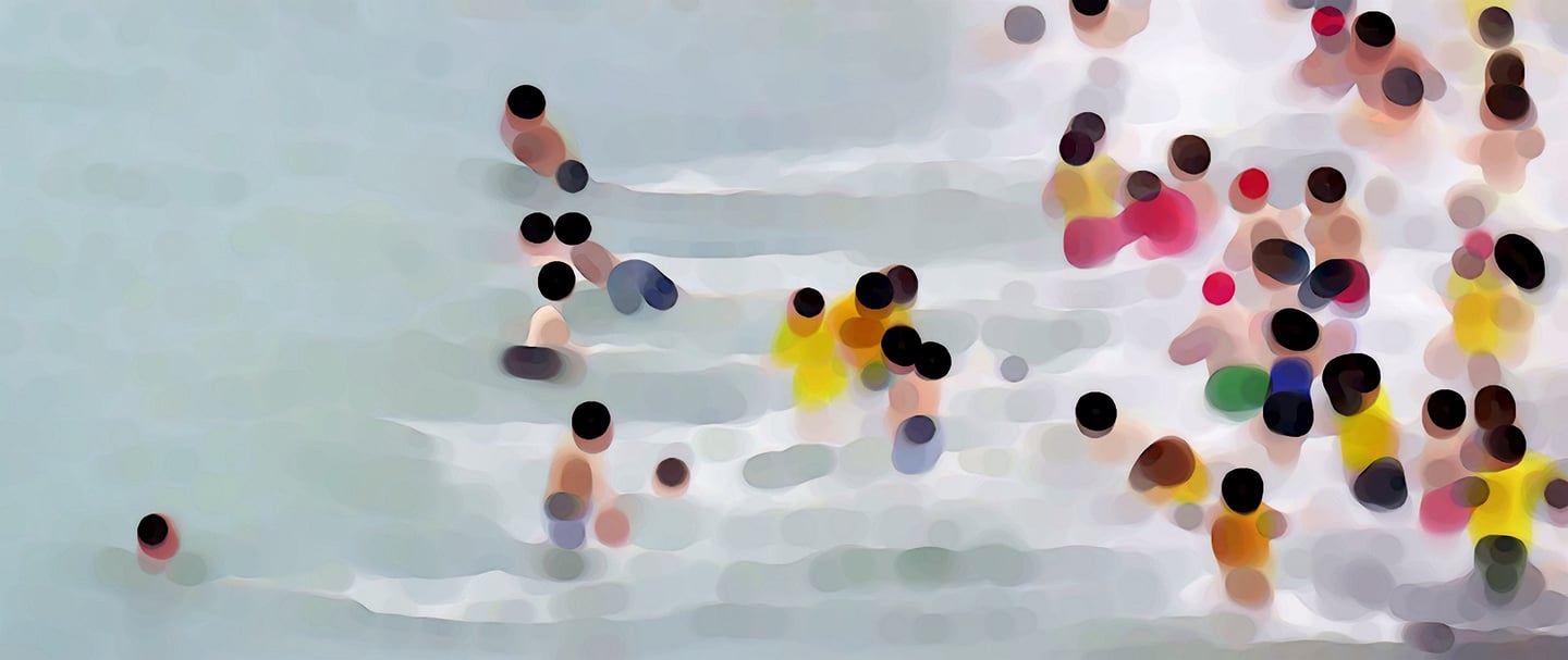 a group of people running in the water
