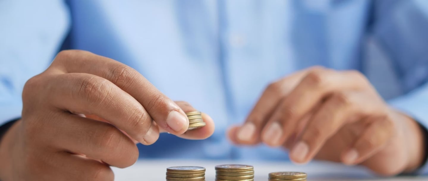 gold coins on table representing beginners guide to gold ira