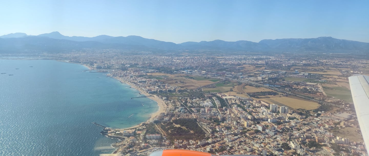 a view of a plane flying over a Mallorca