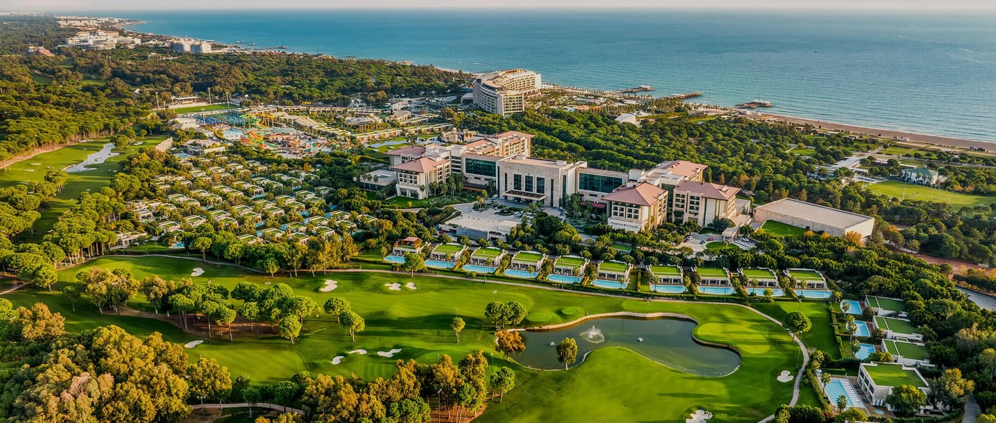 Aerial view of a luxury beachfront golf resort Regnum Carya