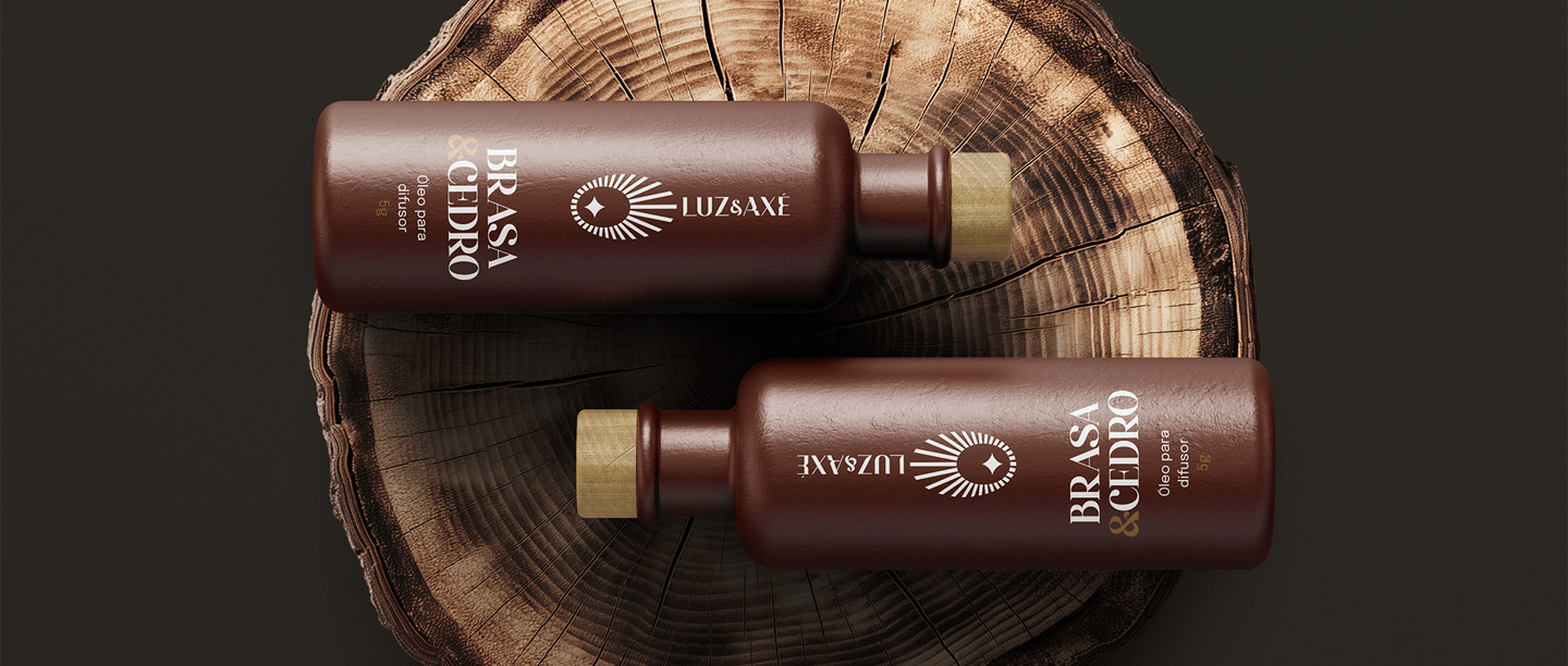 two clay bottles with oil for diffuser and visual identity with Luz & Axé logo