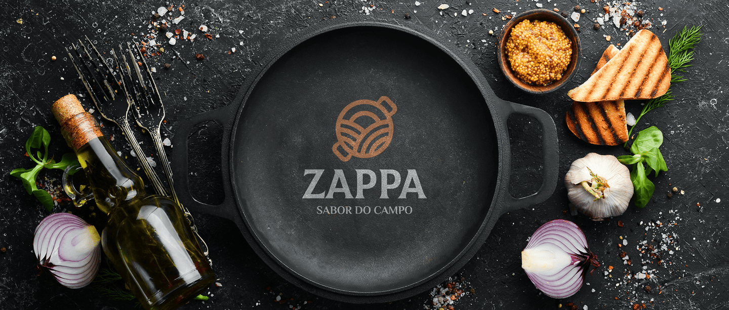 rustic metal pan with applied Zappa logo and seasonings under a table