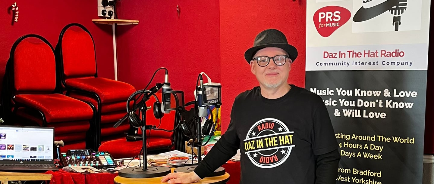 darrel hull (daz)  in a black shirt and a microphone