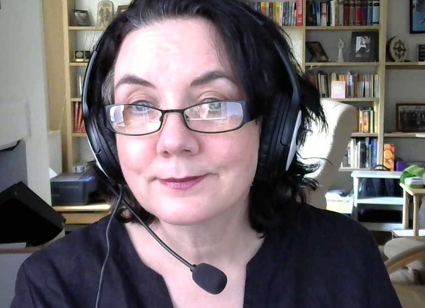 jennie lynch with headphones and a headset on