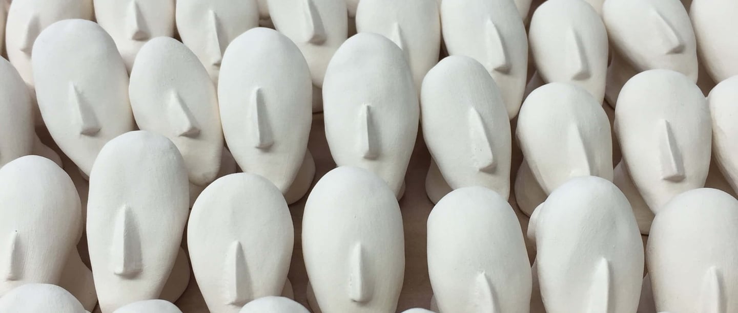 Tiny porcelain heads with big noses