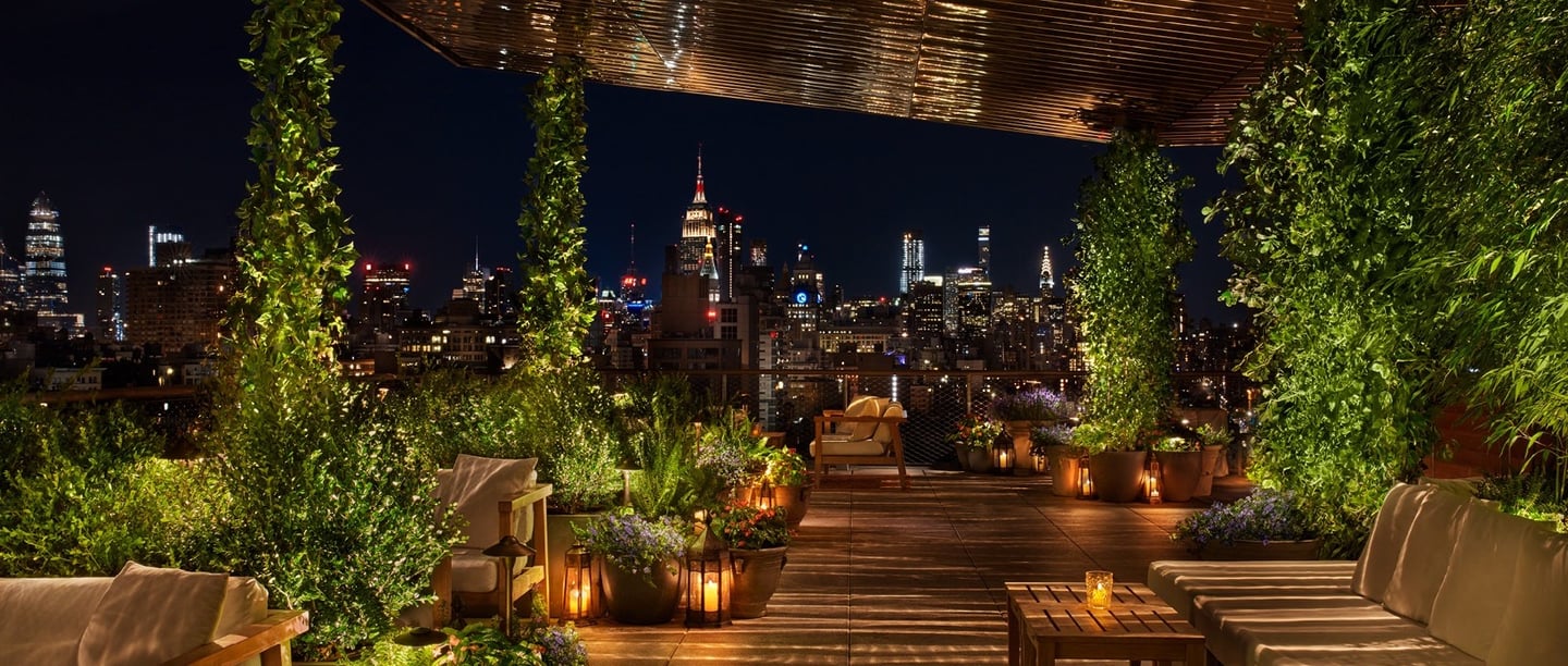The Roof at The Public Hotel – Lush rooftop lounge with stunning NYC skyline views.