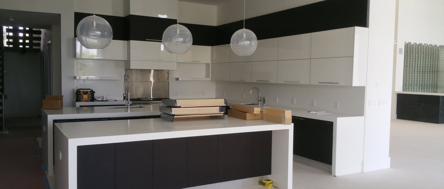 Modern luxury kitchen renovation in Weston featuring custom handle les cabinetry 