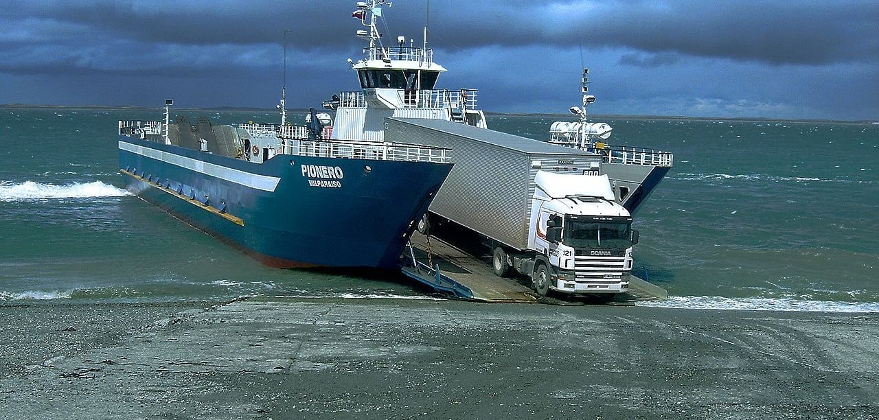 a truck driving on a large body of water