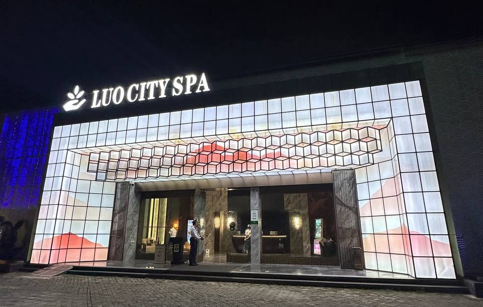 a large building with a large screen screen in front of it