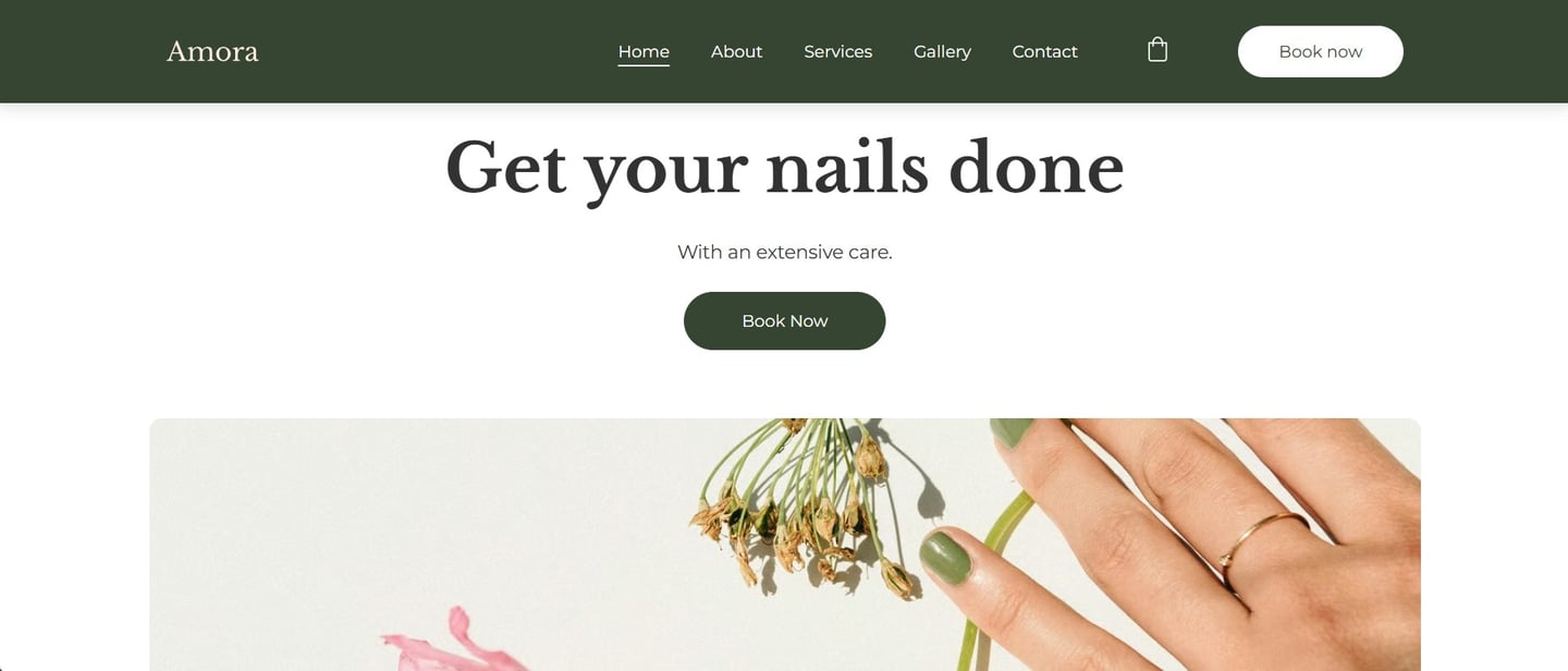 Minimalist website homepage for Amora nail salon featuring green manicured nails and professional services.