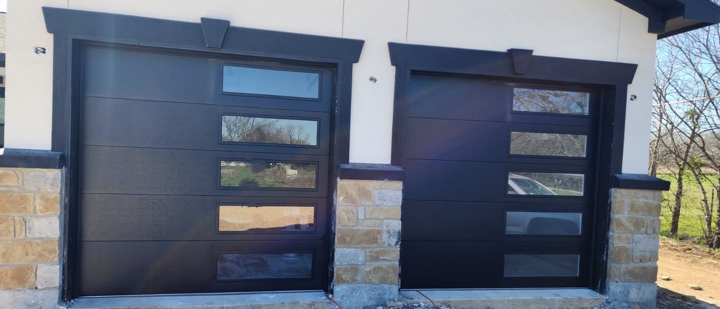 Custom 8x8 black flush Garage doors with window panels on the right hand side