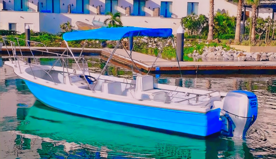 a boat in the water with a blue sky in the background