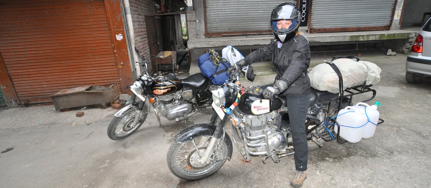 Tracey Billington riding the Leh to Manali highway over the great Himalayan range, Ladakh, India 