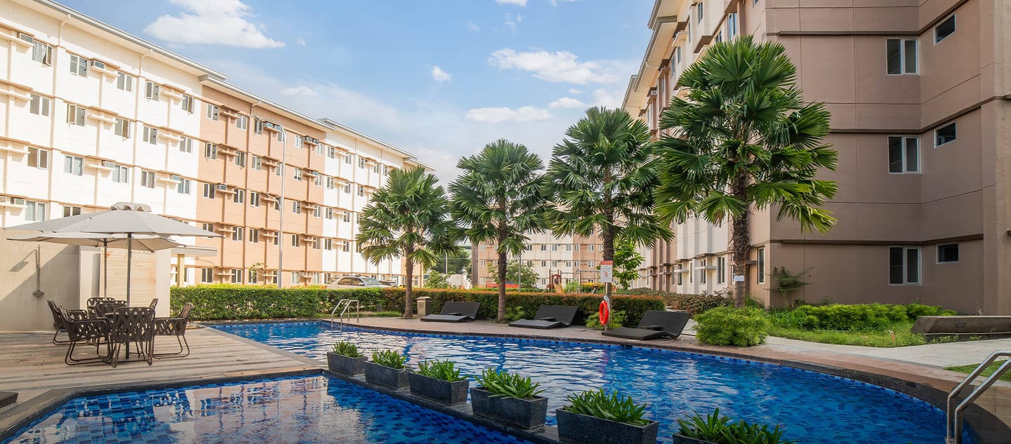 a pool with a lounge chair and a table