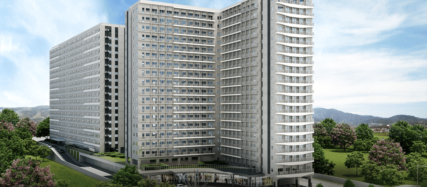 a large building with a tall building in the background