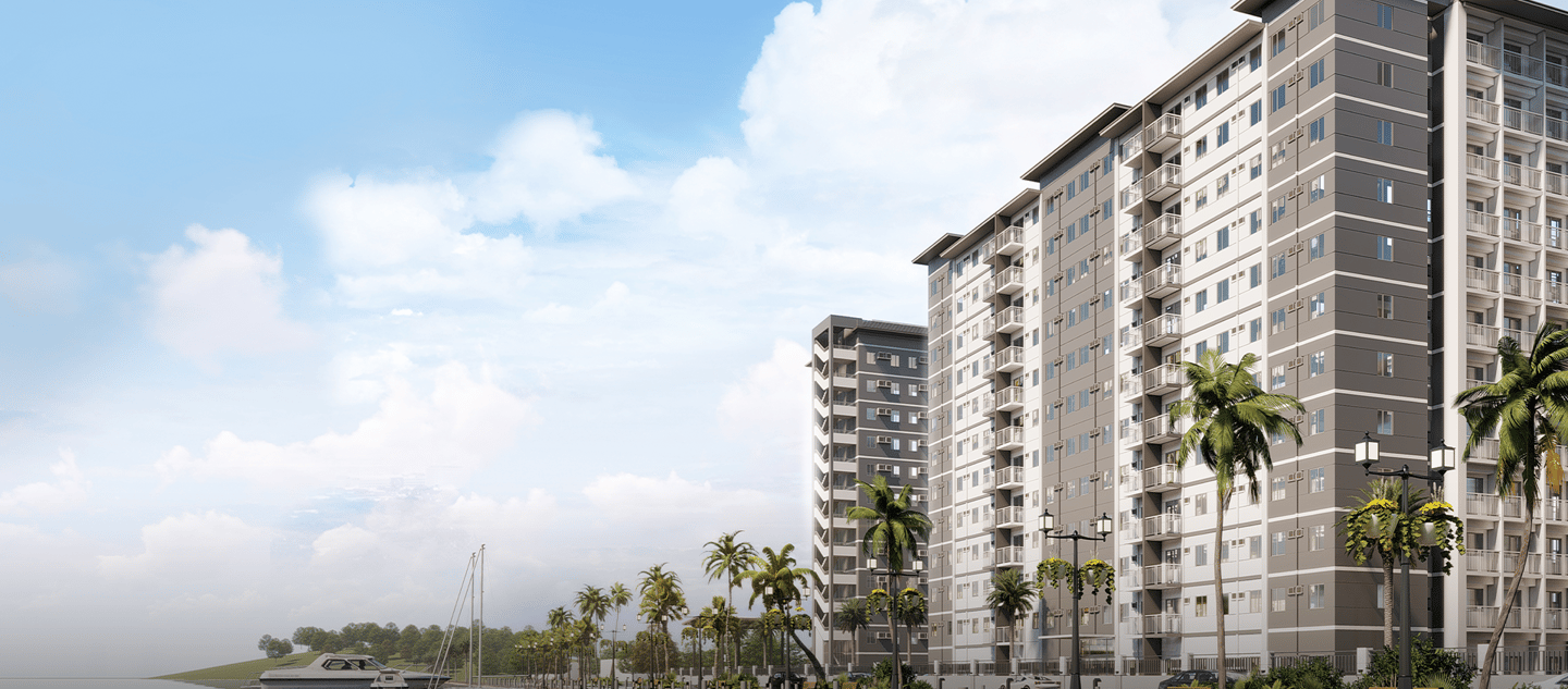 a large apartment building with a boat in the water