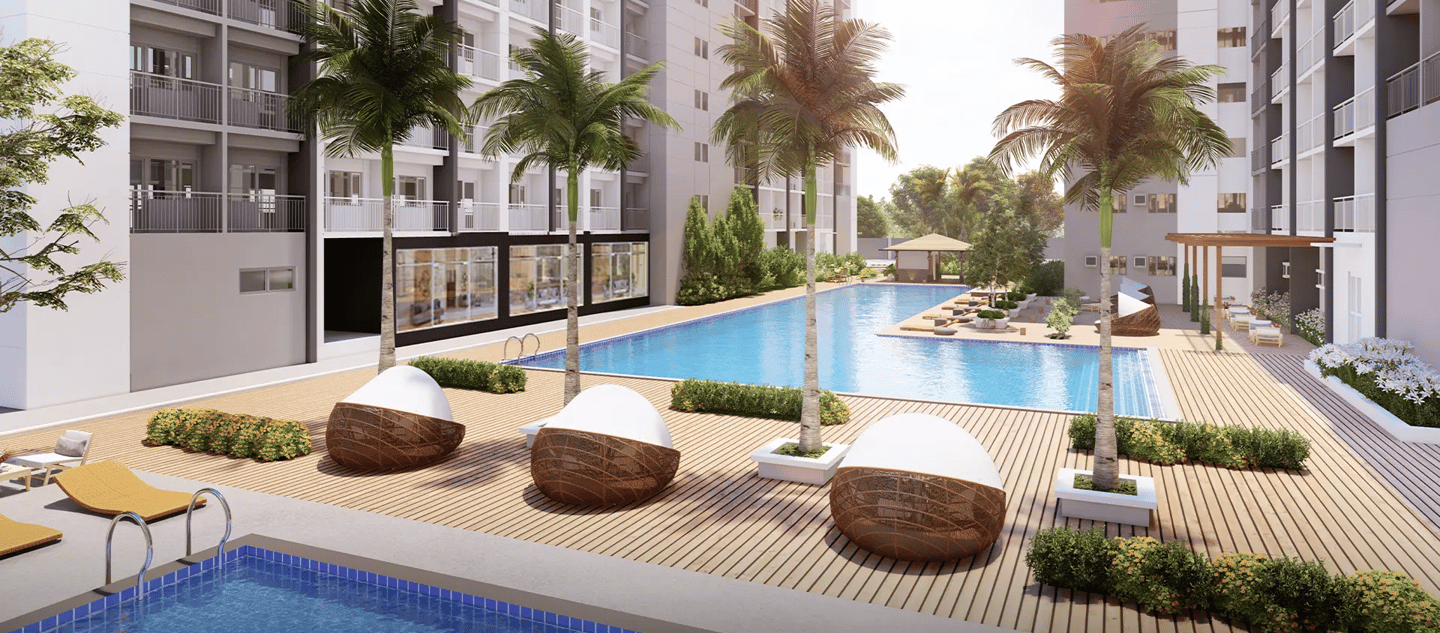 a pool with lounge chairs and a swimming pool