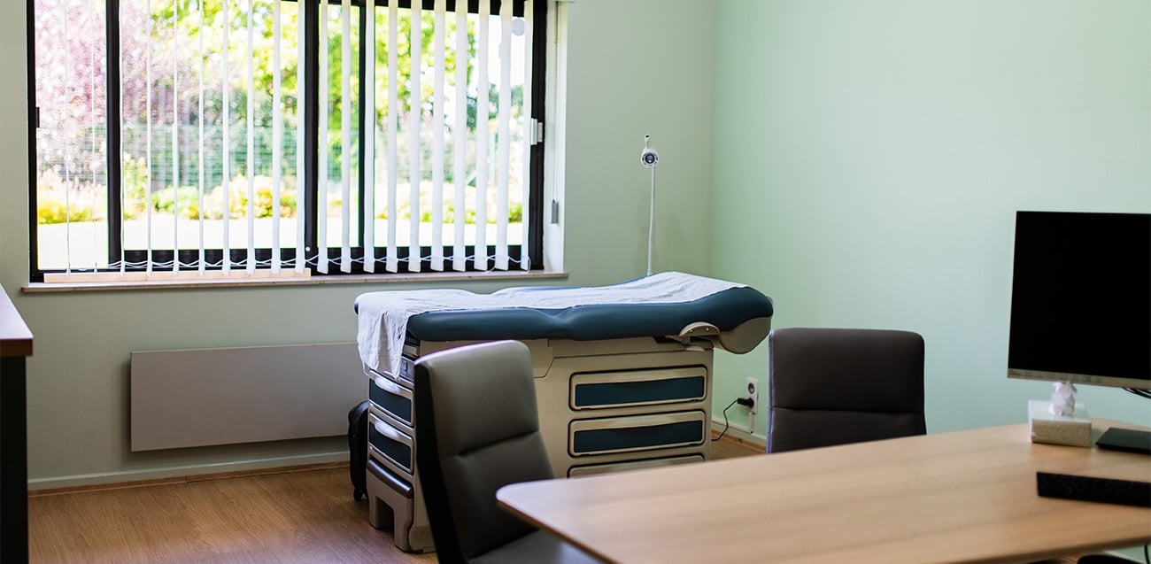 a room with a bed and a desk