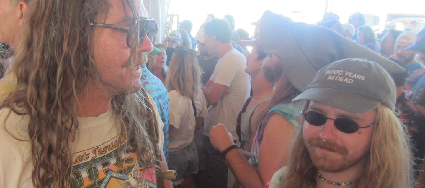 standing in the crowd at a music festival