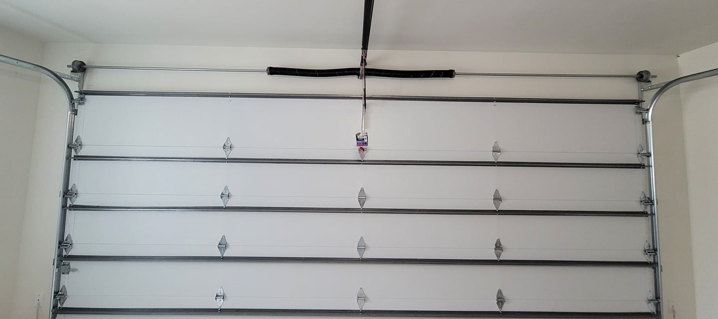 Garage door installed by A's garage doors in Austin tx with a modern garage door torsion spring