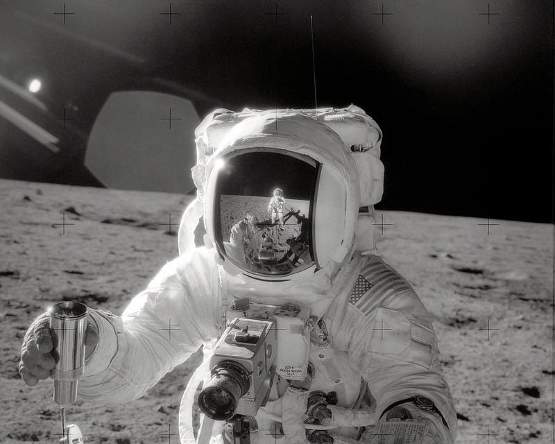 a man in a spacesuit with a camera and a camera