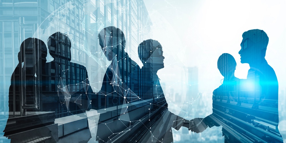 a group of business people shaking hands
