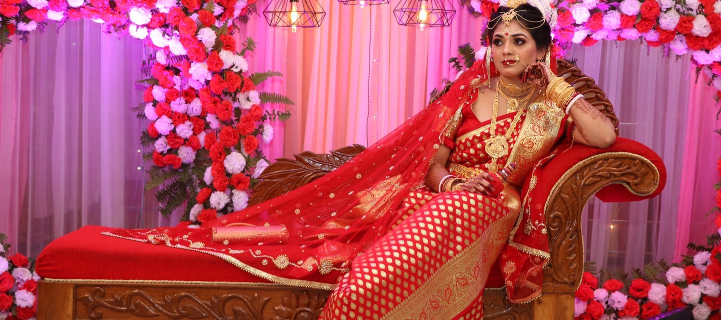 a woman in a red dress and a red and gold dress