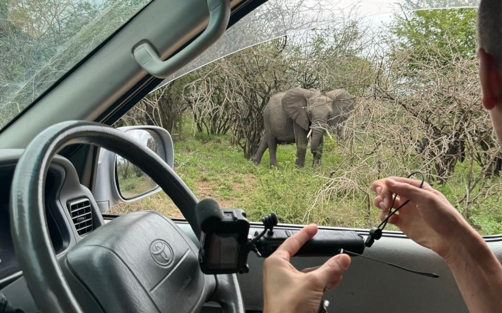 a man in a car with a camera 