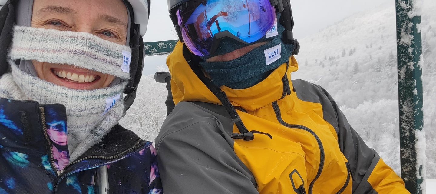 Photo of FACE BASE inventor, Amy, and her partner Steve, wearing FACE BASE prototypes while skiing at Smugglers Notch