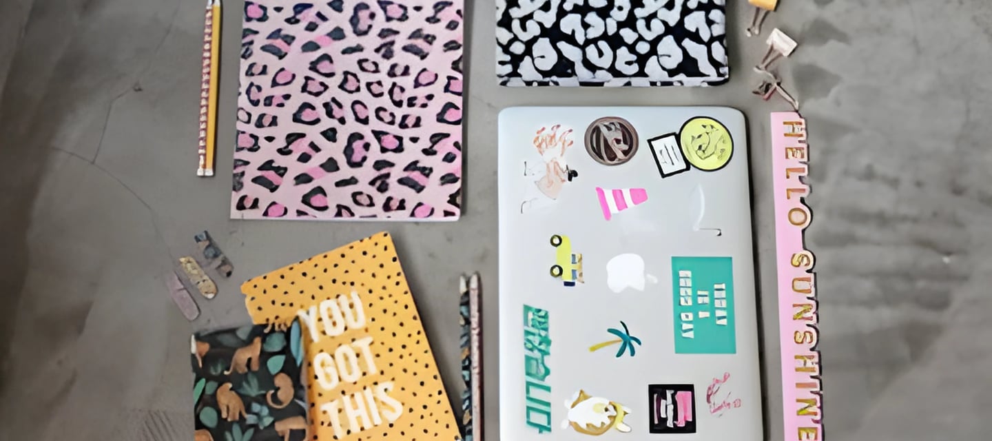 Colorful study setup with laptop and stationery, symbolizing Admit 360's PTE test prep